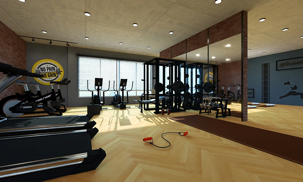 Modern gym at Sarthak Solitaire with premium fitness equipment and spacious workout area