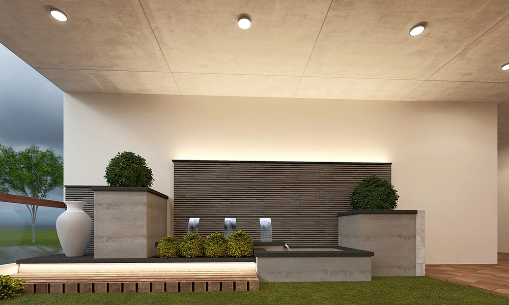 Premium outdoor lounge with water feature at Sarthak Solitaire